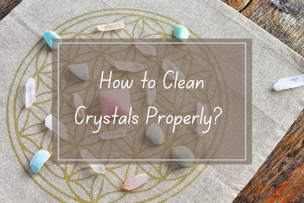 Crystals arranged on a fabric, with the text "How to Clean Crystals Properly?".