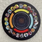 Tarot card-themed circular mousepad showing numbered cards,  "yes," "no," and "maybe" options.  Tarot imagery.