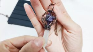Amethyst crystal pendulum necklace, clear quartz point, copper accents.