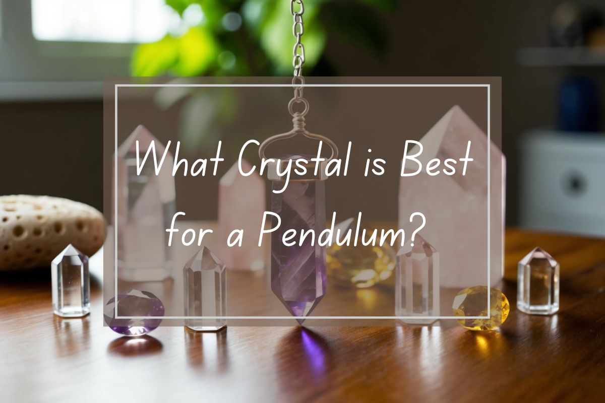 Crystal pendulum, amethyst, quartz crystals on wooden table.  What crystal is best for a pendulum?