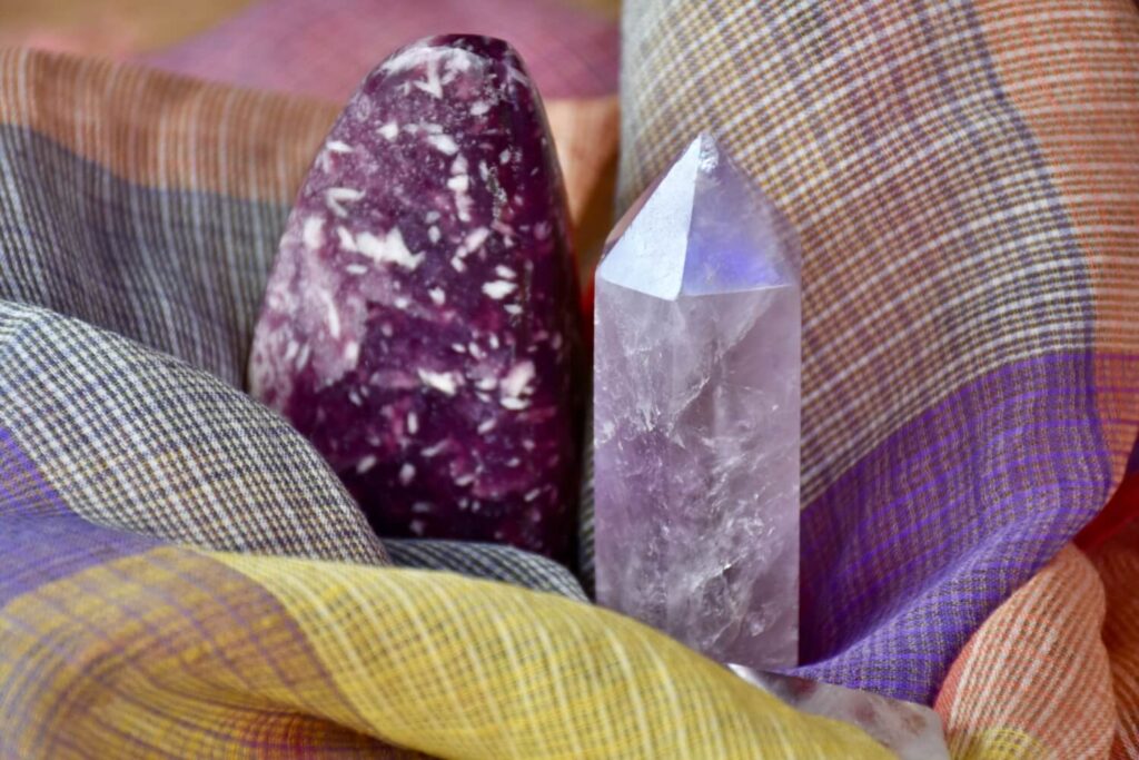 Purple and amethyst crystals on a plaid fabric.