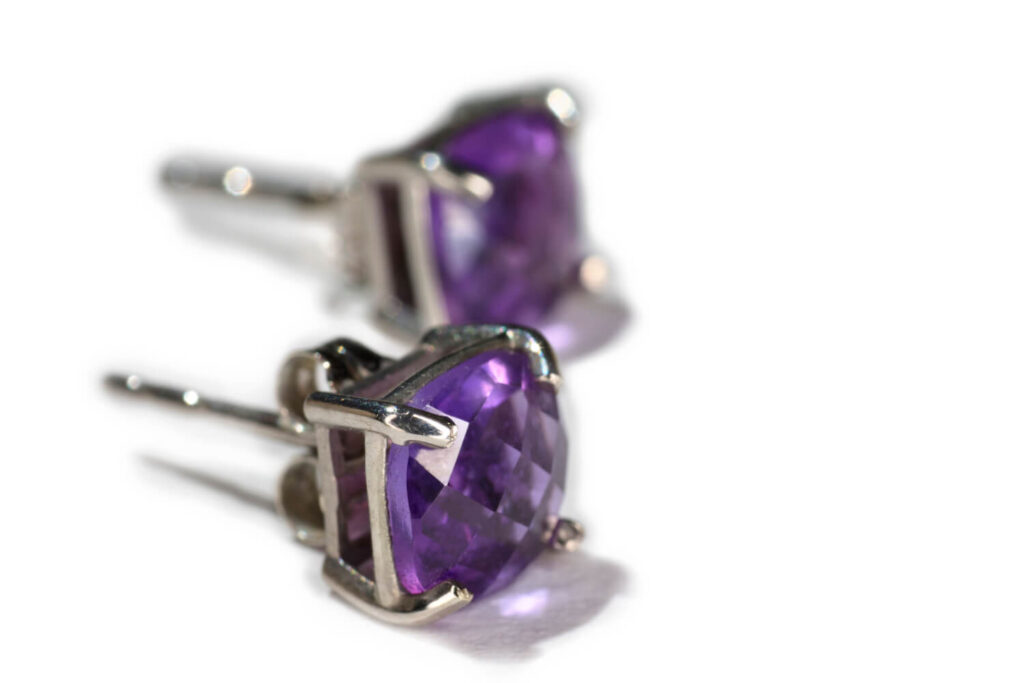 Close-up of amethyst stud earrings.