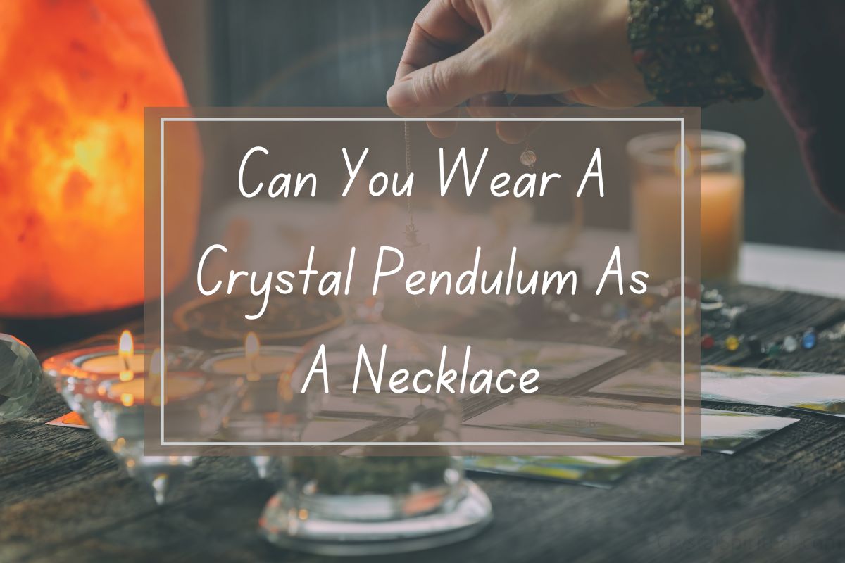 Crystal pendulum as necklace,  spiritual, jewelry,  tarot cards.