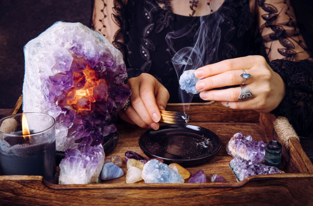 Crystal healing, smudging with sage, amethyst geode,  blue calcite.