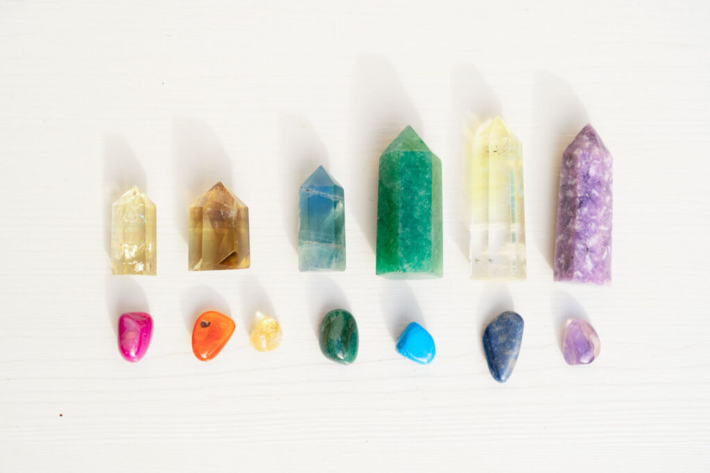 Rainbow of crystals,  different colors and shapes.  Healing stones.
