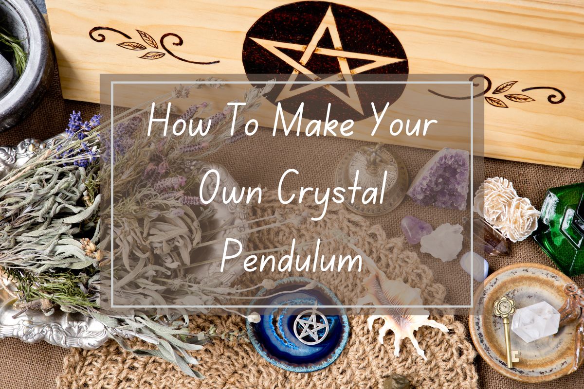 Crystal pendulum making instructions, dried herbs, crystals, and other mystical items laid out on a surface.