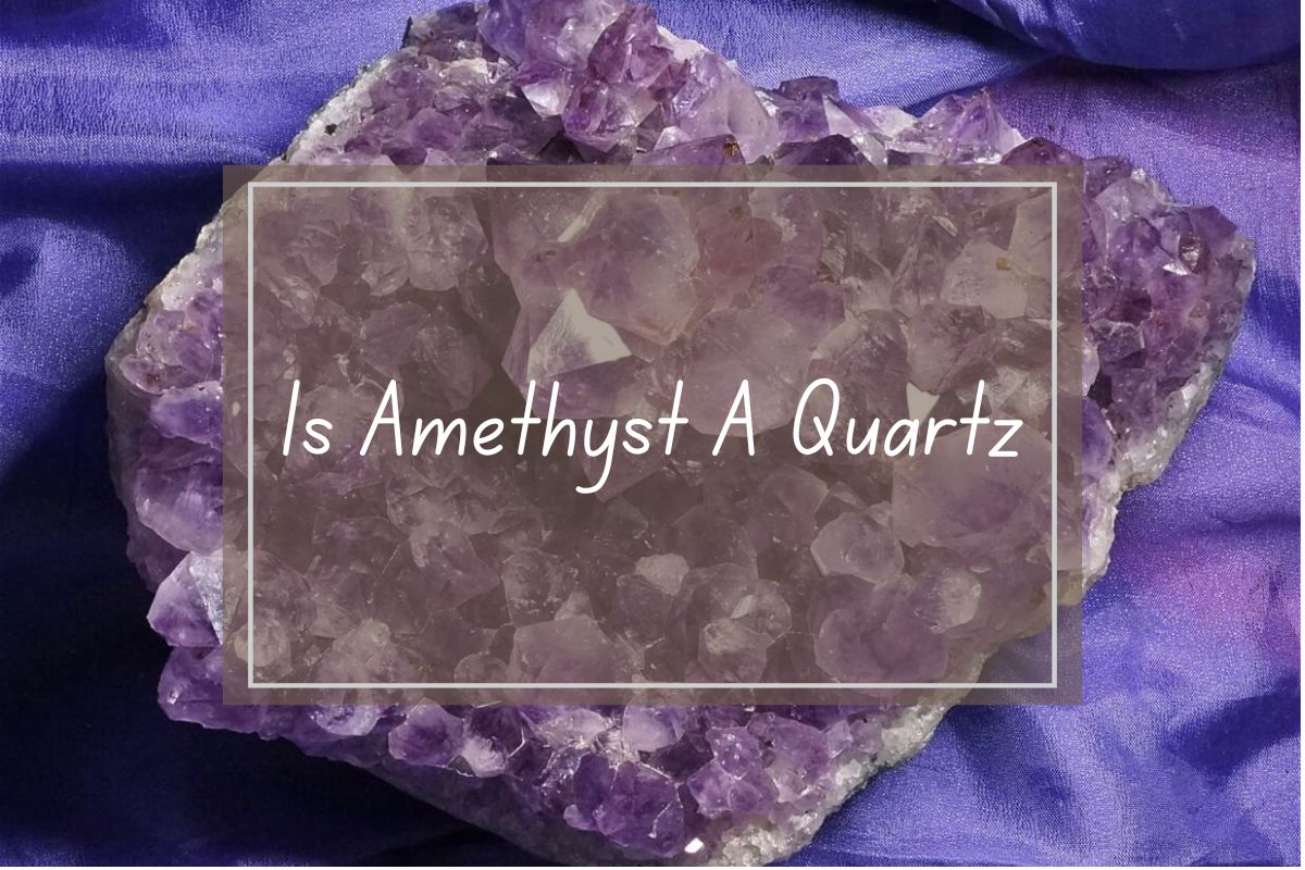 Amethyst cluster, purple quartz crystal, on a purple fabric background.  Question: Is Amethyst a Quartz?