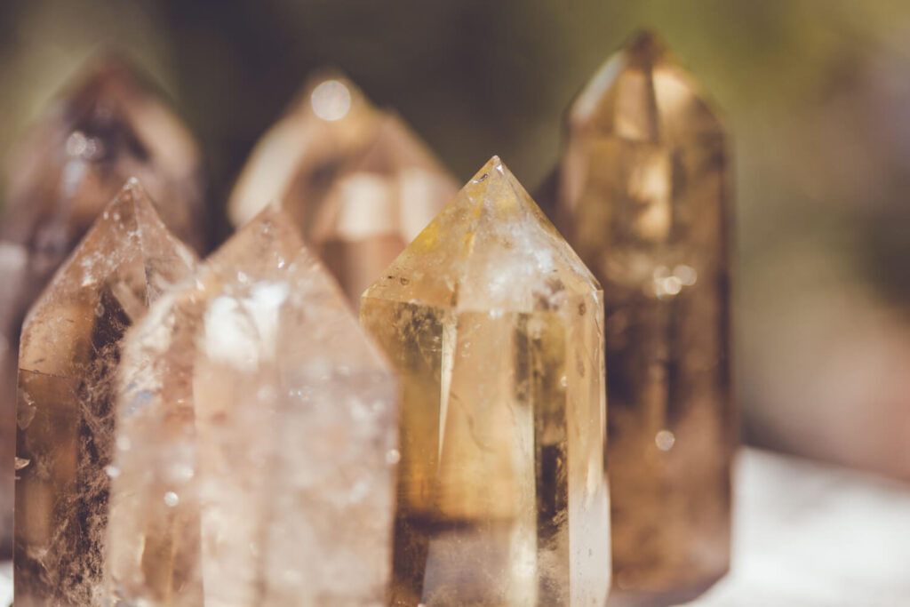 Close-up of several light brown/golden quartz crystals.