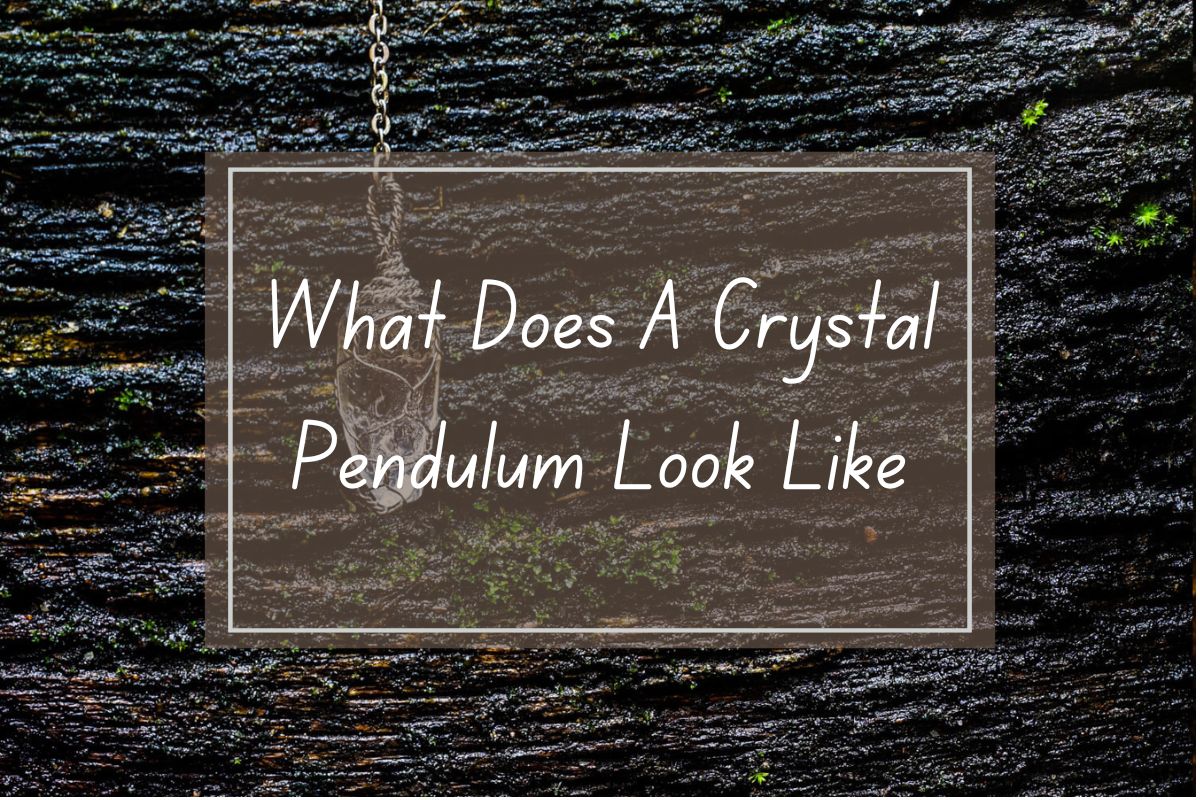 Crystal pendulum on dark wood background.  Question: What does a crystal pendulum look like?