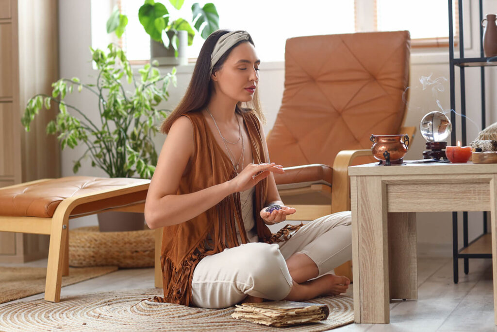 Woman meditating, crystals in hands, spiritual practice.