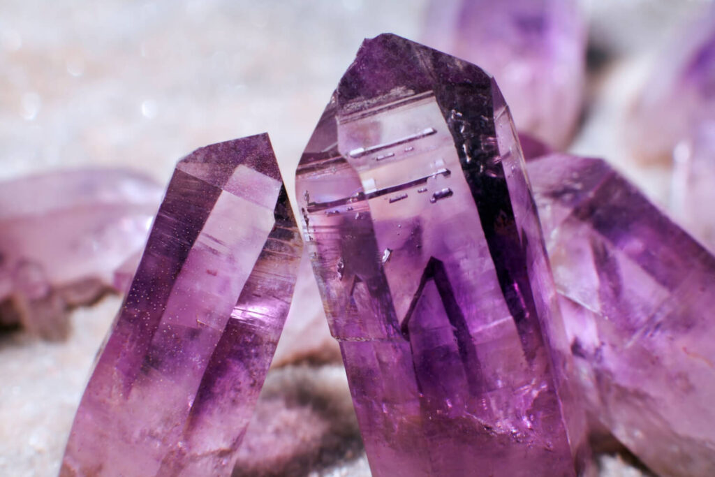 Close-up amethyst crystals, vibrant purple.