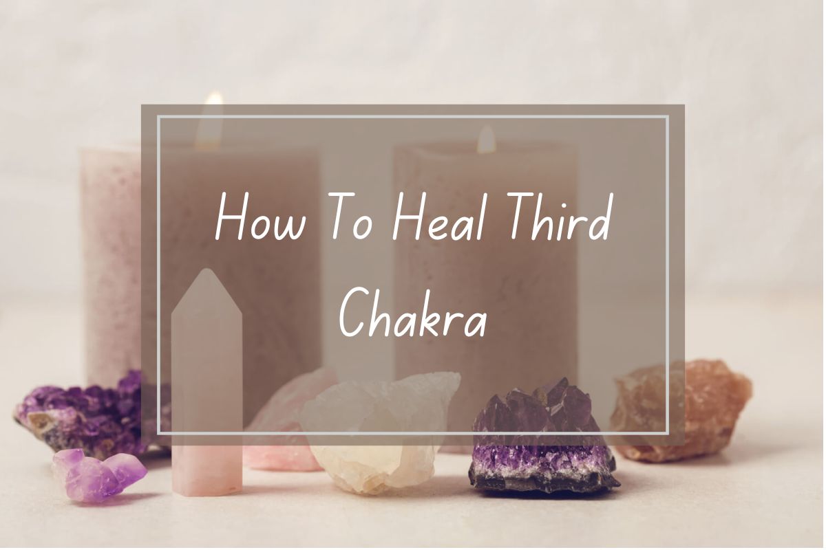 Three candles and various crystals displayed, focusing on healing the third chakra.