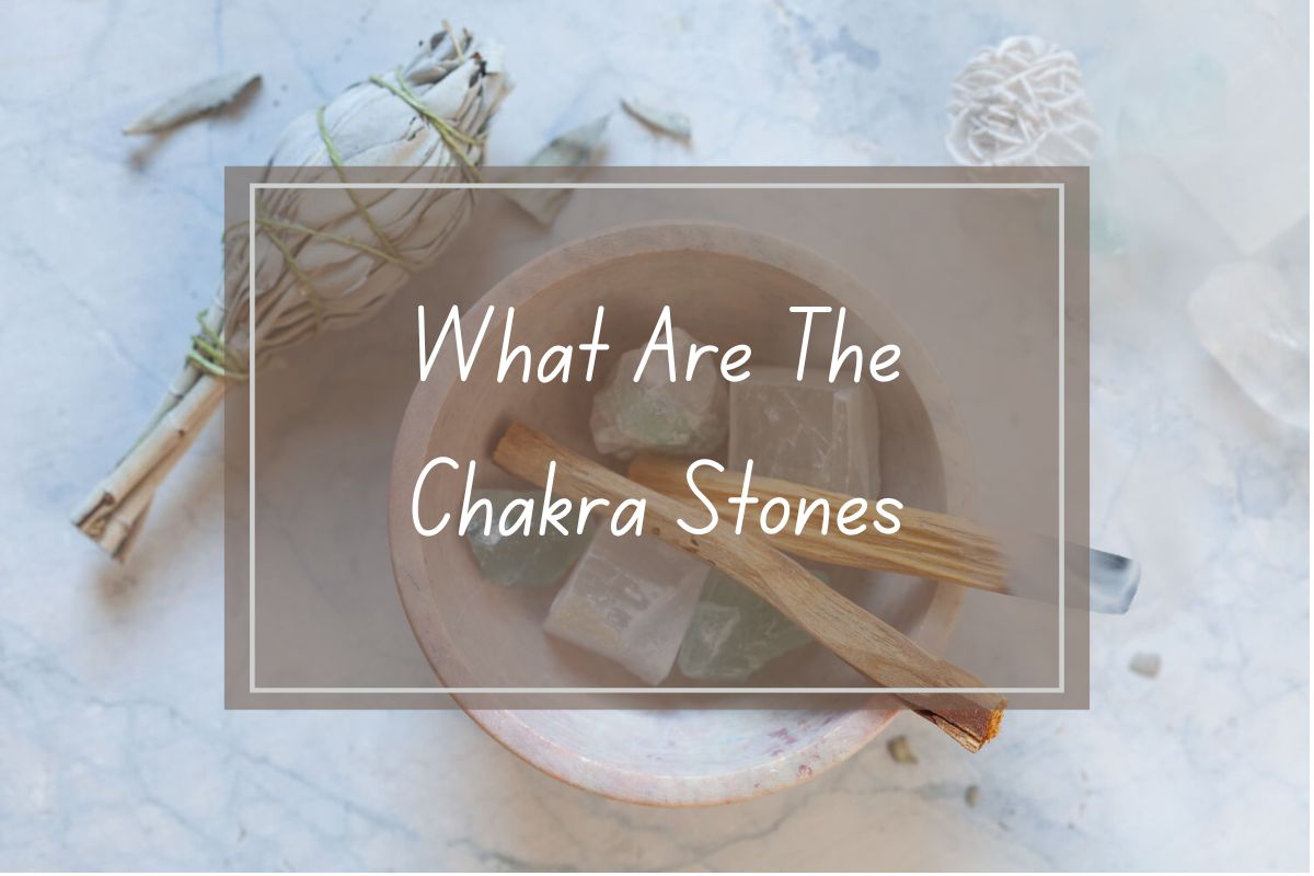 Chakra stones, sage, and palo santo in a bowl.  Title: What are the Chakra Stones.