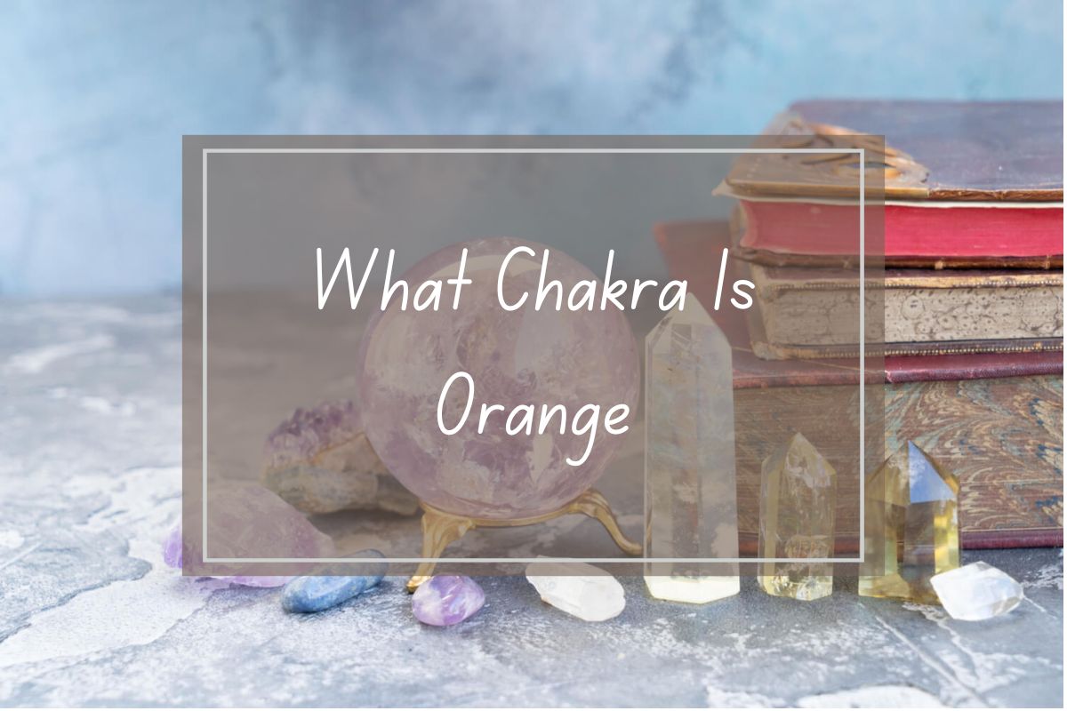Orange chakra, crystals, and books. Mystical stones and vintage books. Spiritual concept.