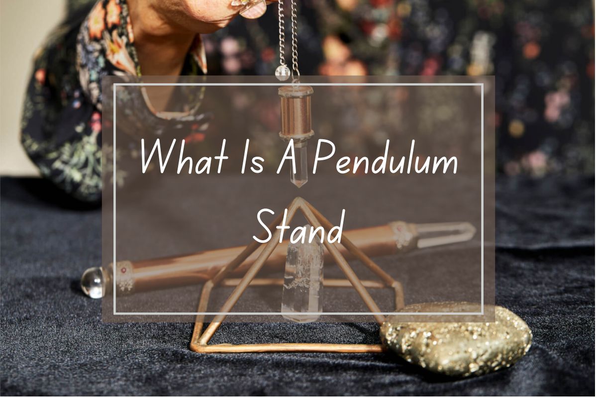 Pendulum stand, crystals, and gemstones. Triangular stand with pendulum, crystal, and gold pyrite stone.
