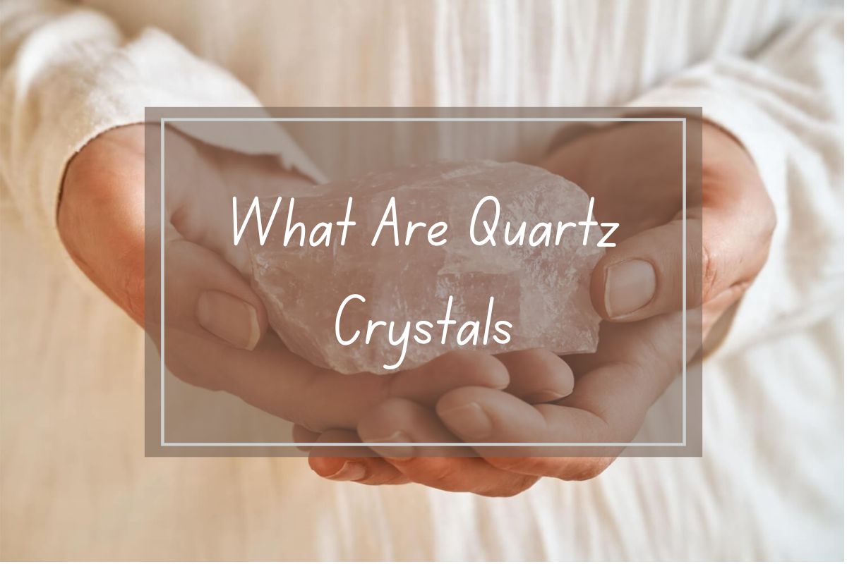 Hands holding a pink quartz crystal.  Quartz crystals.