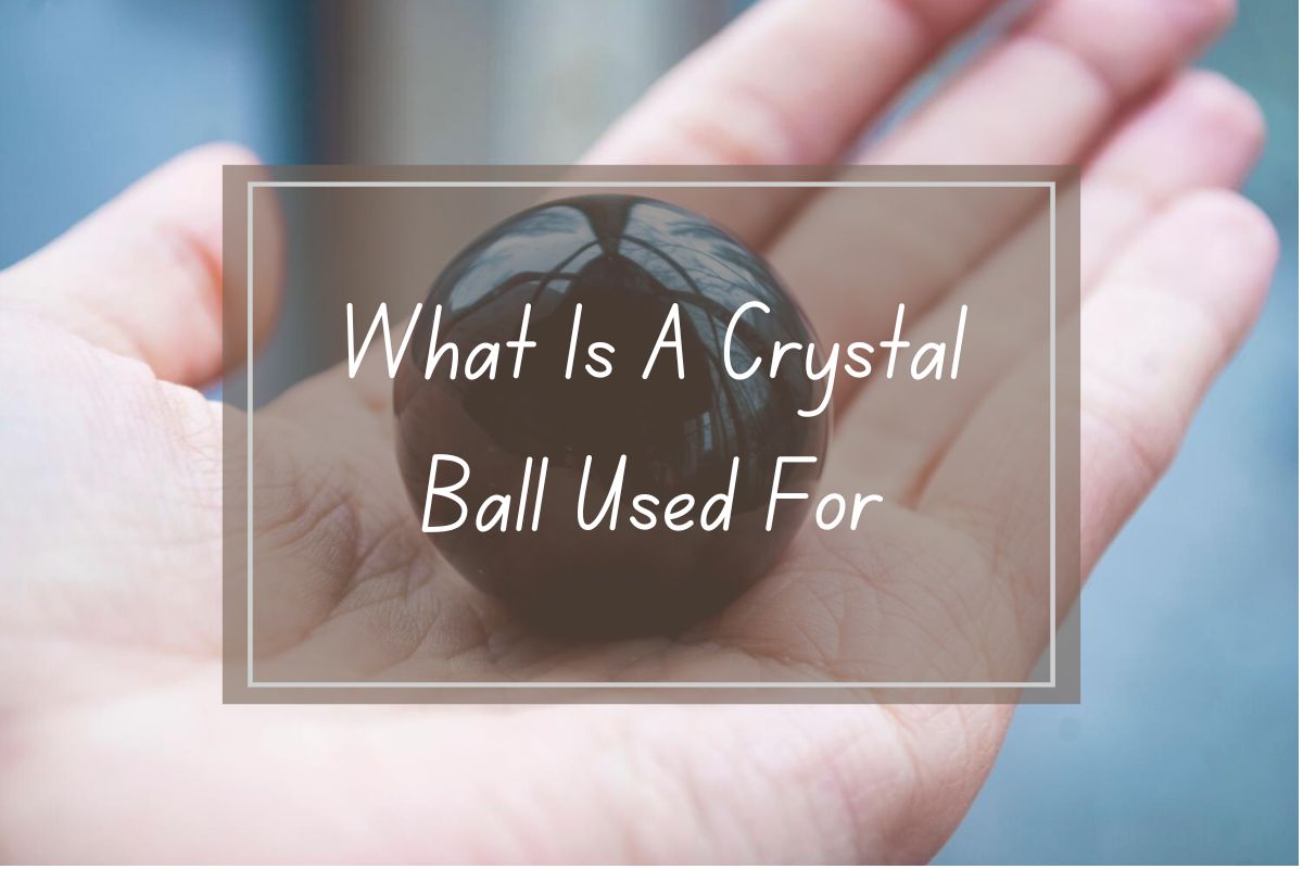Dark crystal ball, held in hand,  article about crystal ball uses.